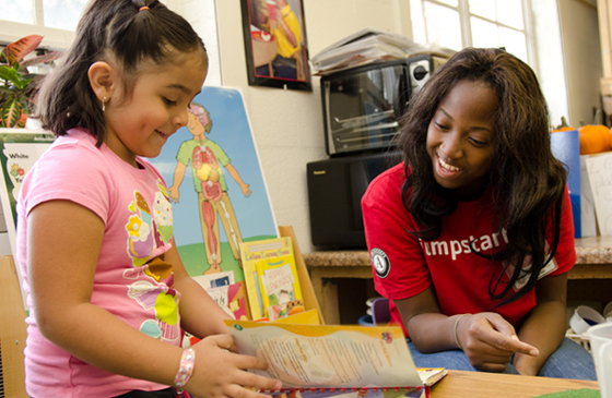 Student teaching a kid