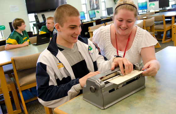 teacher helping student