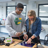 Students working on a tech project. 